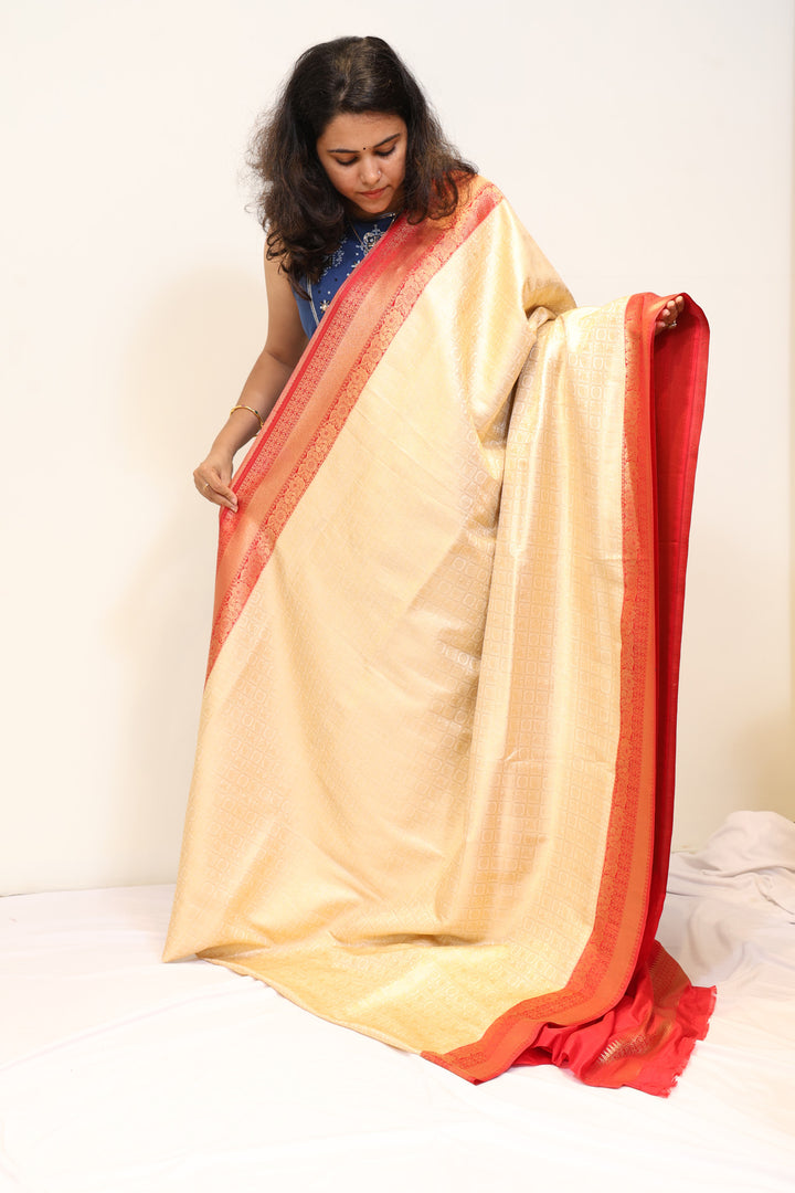 Cream Banarasi Kubera Silk Saree with Coral Red Zari Border