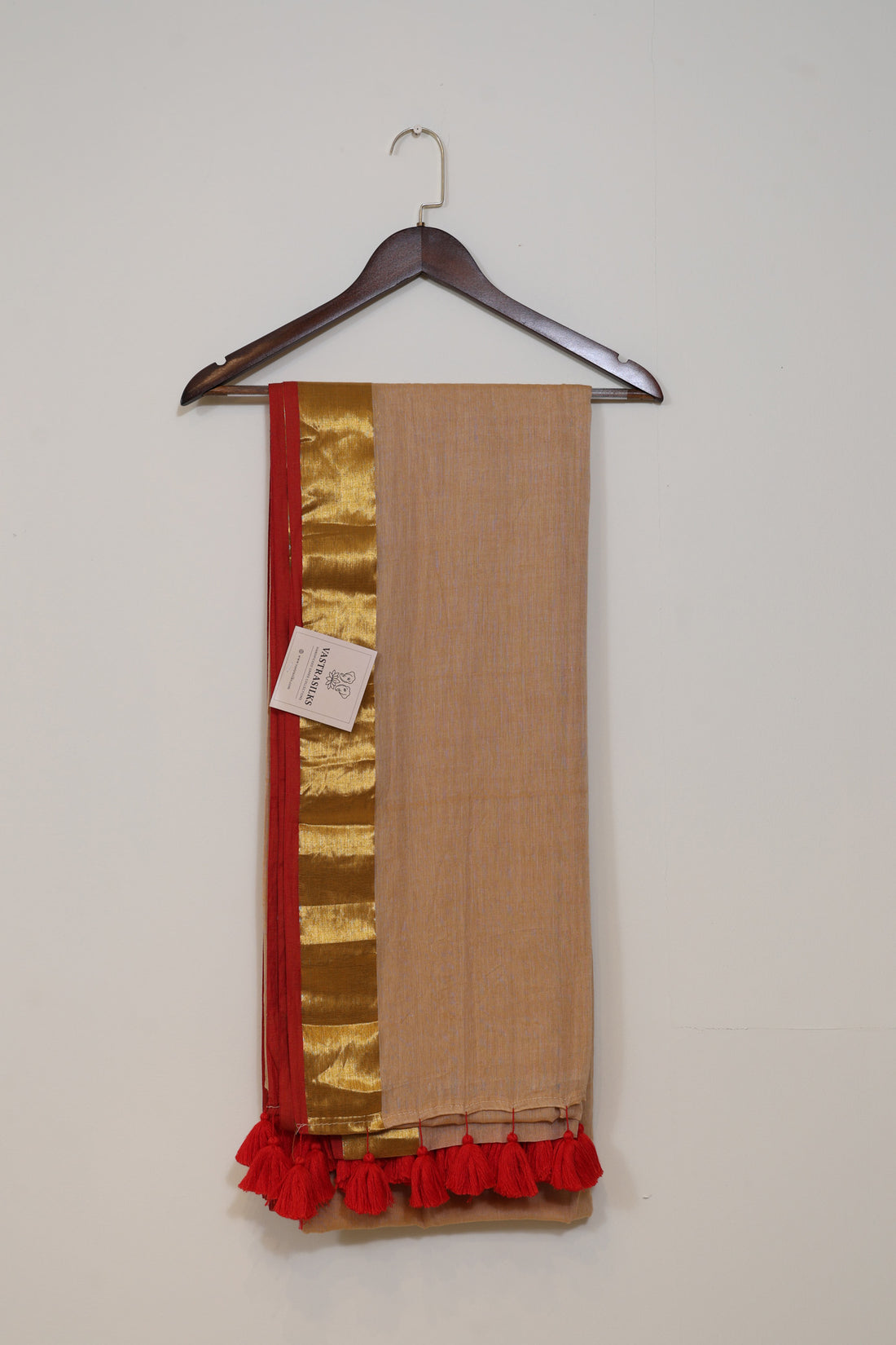 Peach Mul Cotton Saree with Golden Border and Red Tassels